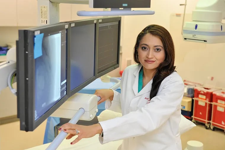 Anesthesiologist Dr. Anita Gupta, who has been raising public awareness concerning the synthetic opioid W-18,  stands in front of x-ray monitors in a procedure room at Hahnemann University Hospital.
