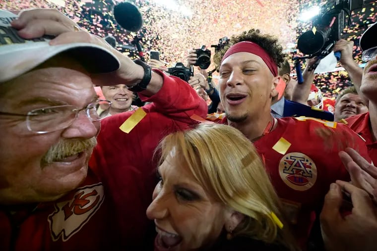 Kansas City coach Andy Reid, his wife, Tammy, and quarterback Patrick Mahomes celebrate after the Chiefs defeated the San Francisco 49ers in the Super Bowl.