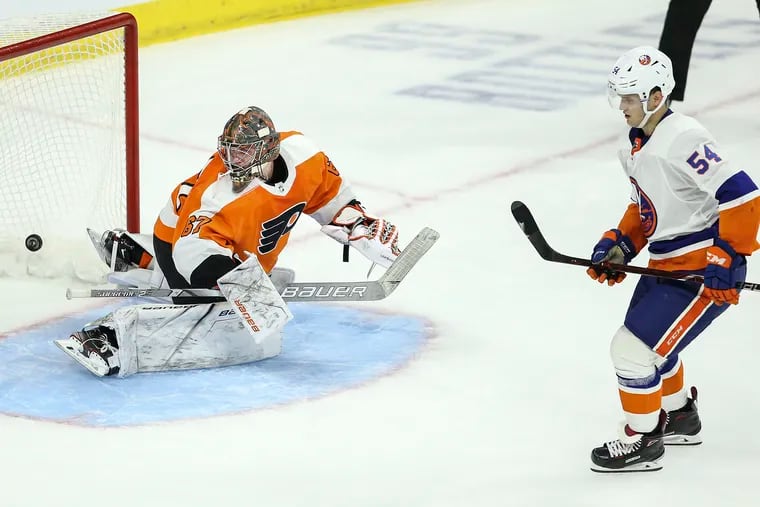 Flyers goalie Kirill Ustimenko trying, in vain, to stop a shootout shot from the Islanders' Oliver Wahlstrom during a rookies game in the preseason.