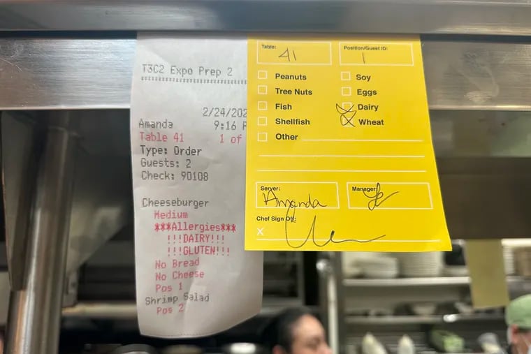 An oversized yellow ticket noting allergies is automatically generated at Parc, and all Starr restaurants, when a diner notes a dietary need. It stays with the diner's order through every step in the meal.
