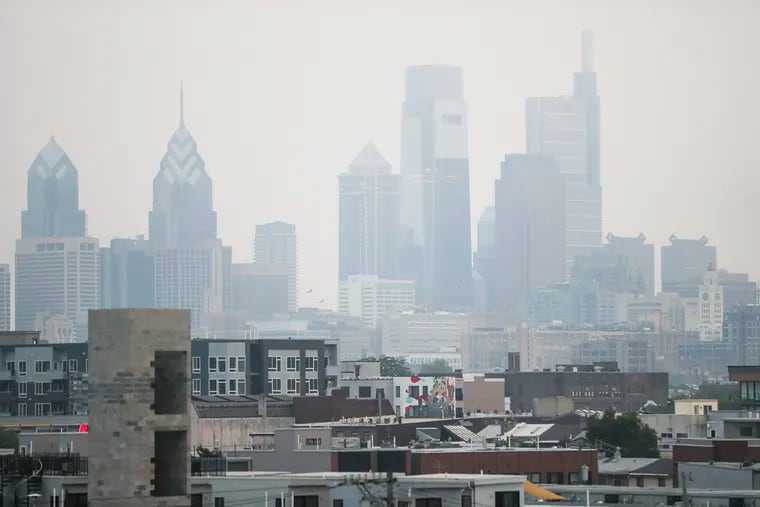Smoke from Canada’s wildfires makes for a hazy Philadelphia skyline on Tuesday. There is an air quality alert in the region through Wednesday.