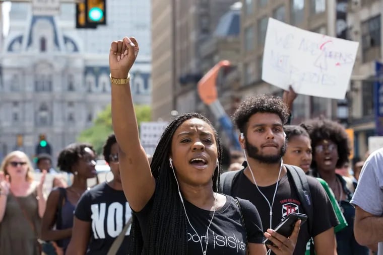 Ciarra Walker (center) during “A March For Black Women,” which started at City Hall and ended at Cecil B. Moore Avenue.