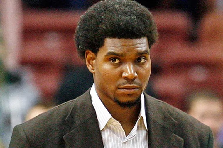 Philadelphia 76ers' Andrew Bynum stands on the court before an NBA preseason basketball game against the Boston Celtics, Monday Oct. 15, 2012, in Philadelphia. Bynum on Monday will receive an injection of Synvisc, a gel-like substance that sometimes provides relief for inflamed tissue, on his injured right knee. (AP Photo/H. Rumph Jr)