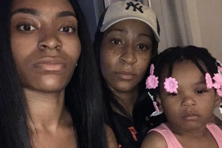 Alicia Russell-Jenkins (center), her daughter, Dominique Jenkins (left), and granddaughter Malina Jenkins. Russell-Jenkins and her family believe the woman who killed her father in 1984 should not have been released from prison for health reasons.