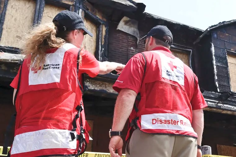 Members of the Red Cross's Disaster Relief team after the Gesner Street fire, which no one seems to know who started.