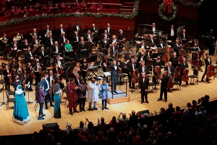 Philly POPS music Director and Principal Conductor David Charles Abell (center) along with members of The Philly POPS Festival Chorus, The Philadelphia Boys Choir, the African Episcopal Church of St. Thomas Gospel Choir, and Santa receive applause at the conclusion of A Philly POPS Christmas: Spectacular Sounds of the Season at the Kimmel Cultural Campus in early December.