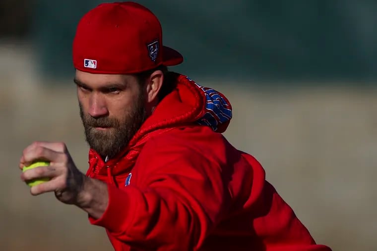 Bryce Harper goes through infield drills early in the morning during Phillies spring training in Clearwater, Fla.