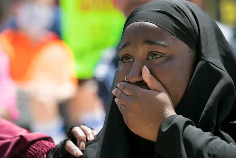 Sanaa Beaufort, a junior at North Penn High School, tears up while speaking during a press conference and rally on the steps of the Montgomery County Courthouse in Norristown on July 14. Beaufort, a Black Muslim student, said she was attacked by two students in the school cafeteria in May.
