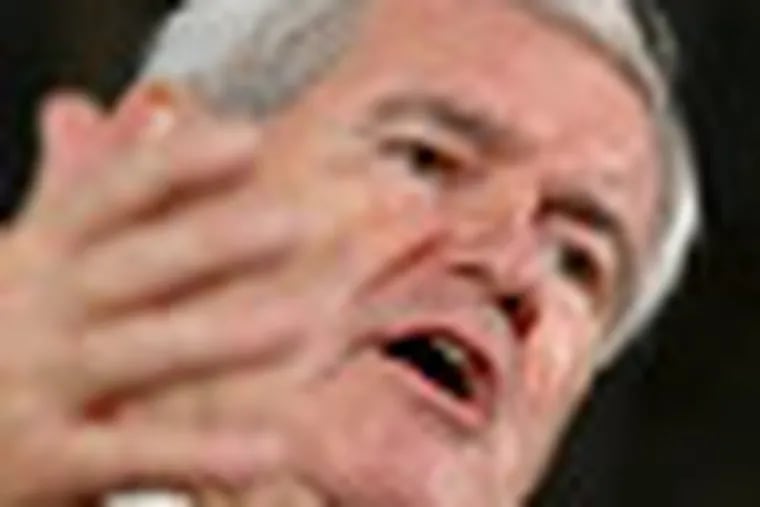 Republican presidential candidate, former House Speaker Newt Gingrich speaks during a campaign stop Global Security Services in Davenport, Iowa, Monday, Dec. 19, 2011. (AP Photo/Chris Carlson)
