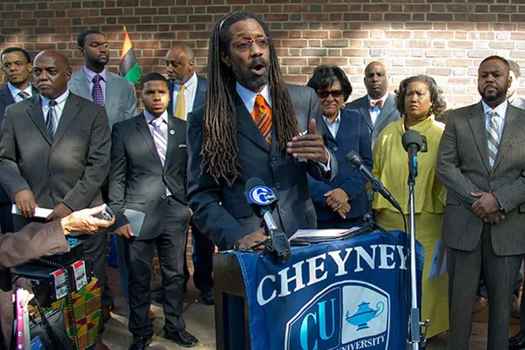 Lawyer Michael Coard, a 1982 graduate of Cheyney University, announces a lawsuit filed 33 years ago  against the state of Pennsylvania, alleging a dual ystem of higher education, will be reinstated within 10 days if the state does not begin negotiations to address financial support for the university.  The press conference took place outside the Federal Courthouse in Philadelphia on Monday, Sept. 23, 2013.   ( CLEM MURRAY / Staff Photographer )