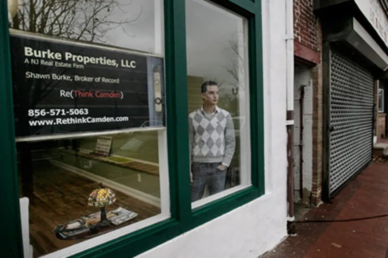 Real estate broker Shawn Burke, who is working to rehabilitate Market Street, fears police layoffs will bring crime to his Cooper Grant neighborhood. (Elizabeth Robertson / Staff Photographer)