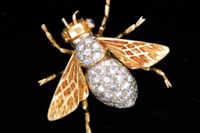A 14-karat yellow-gold bee pin set with 40 diamonds is expected to bring $550 to $750.