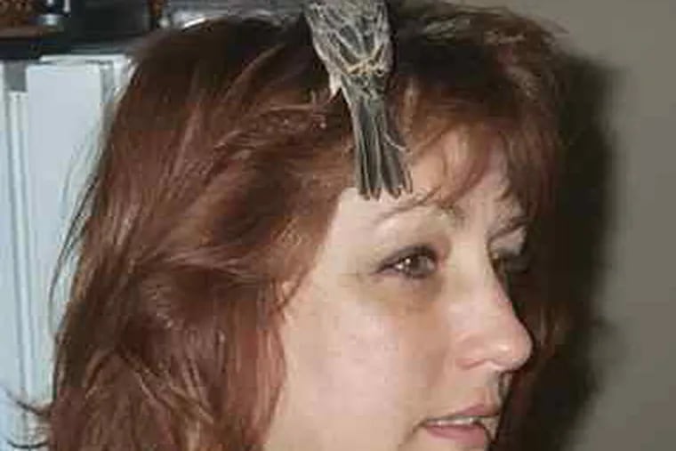 Pati Mattrick and Stormy Girl. She rescued and nurtured the bird, only to have it taken away by a state agency.