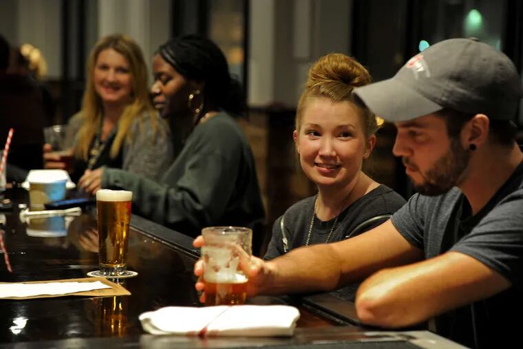 Seated at the bar at Victory Brewing Co. in Kennett Square are (from front right to back): Brandon Perry, Katelyn Coombs, Michelle Flowers, and Tammy Fryer.