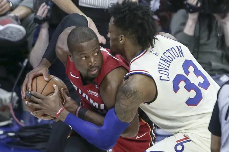 Robert Covington defends against the Heat's Dwyane Wade during the 3rd quarter of the Sixers' 113-103 loss to Miami Monday night in Game 2 of the first-round series.
