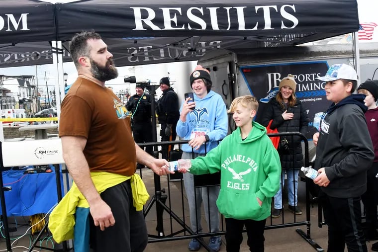 Jason Kelce grabs a drink at the Mike's Seafood Polar Bear Run/Walk for Autism on Saturday.
