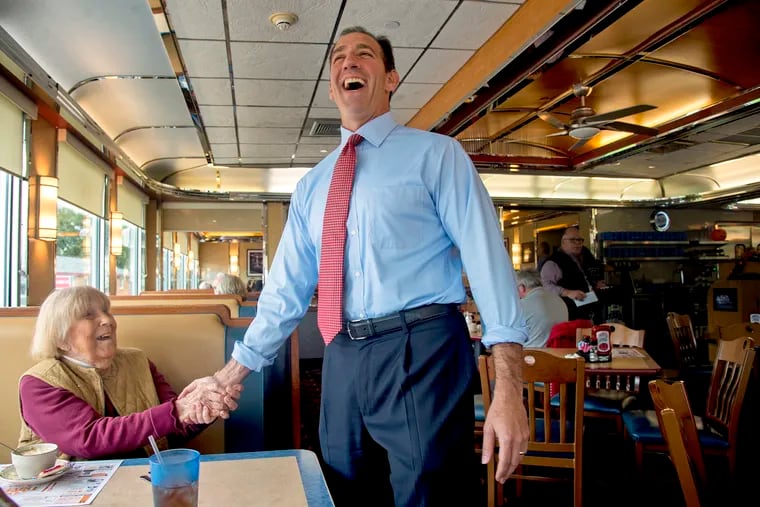 Greeting voters at the Trivet Diner in Allentown October 15, 2018, Republican candidate for lieutenant governor Jeff Bartos reacts as Joan Kraipovick tells him when she arrived for lunch, "I thought they were having a funeral back there," as his supporters where gathering in a side room.