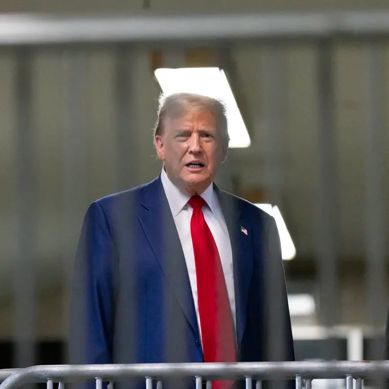 Former President Donald Trump talks to reporters as leaves the courtroom following the day's proceedings in his trial at Manhattan criminal court in New York on Tuesday.