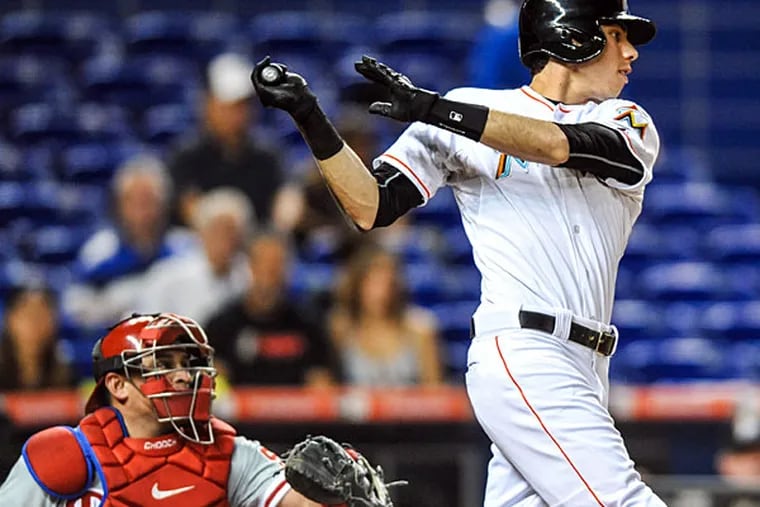 Miami Marlins center fielder Christian Yelich (21) connects for a base hit during the first inning against the Philadelphia Phillies at Marlins Park.