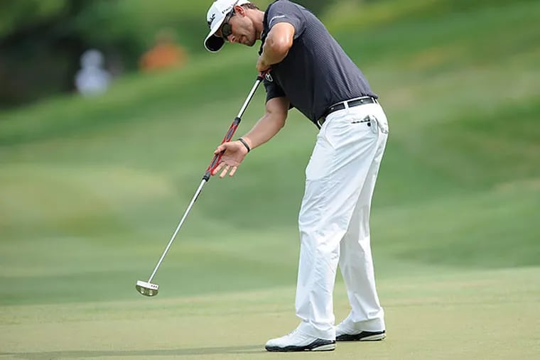 Adam Scott is one of the most prominent users of an anchored belly putter. (Nick Wass/AP)