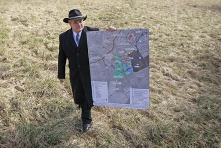 Jerry Hurwitz, president of the Princeton Battlefield Society and an opponent of the housing plan, walks at the disputed site. (David Swanson / Staff Photographer)