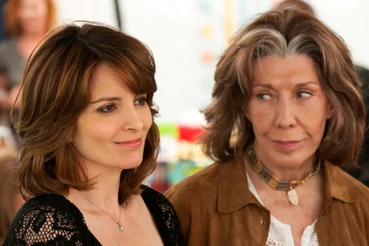 This film image released by Focus Features shows Tina Fey, left, and Lily Tomlin in a scene from "Admission." (AP Photo/Focus Features, David Lee)
