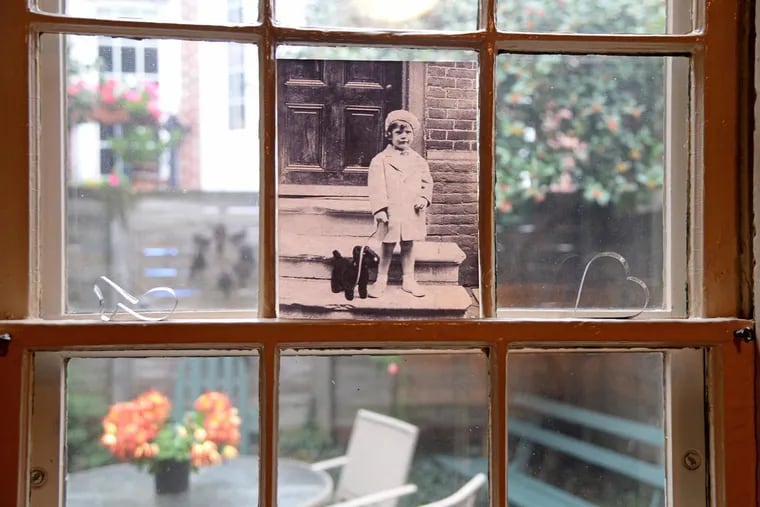 A photo of a 4-year-old Margie McCarthy Simon posing in 1936 on the front stoop of the home on historic Elfreth's Alley owned for the past 40 years by Rob and Sue Kettell.