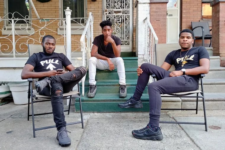 Vine Woods (center) started smoking cigarillos when he was 16. His friends Antonio Murell (left) and Terrell Bullock (right) don't smoke but know many young kids that do.