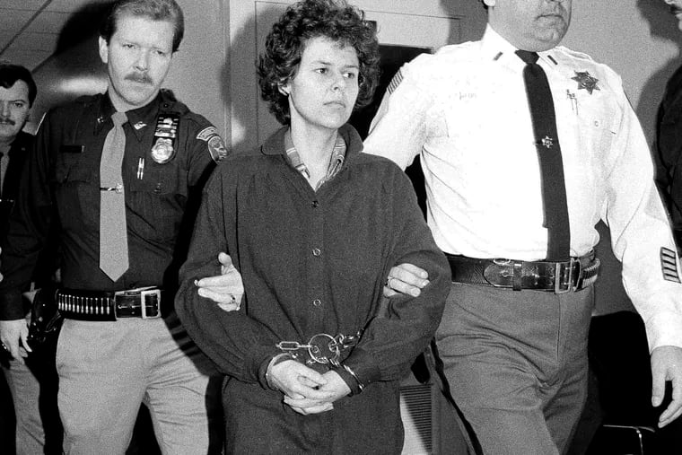 FILE - In this Nov. 24, 1981, file photo, Weather Underground member Judith Clark is handcuffed as she is escorted into Rockland County Courthouse in New City, N.Y.