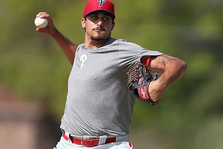 Zach Eflin pitches during themorning workout session at Phillies spring training in Clearwater, Fla. (David Maialetti/Staff Photographer)