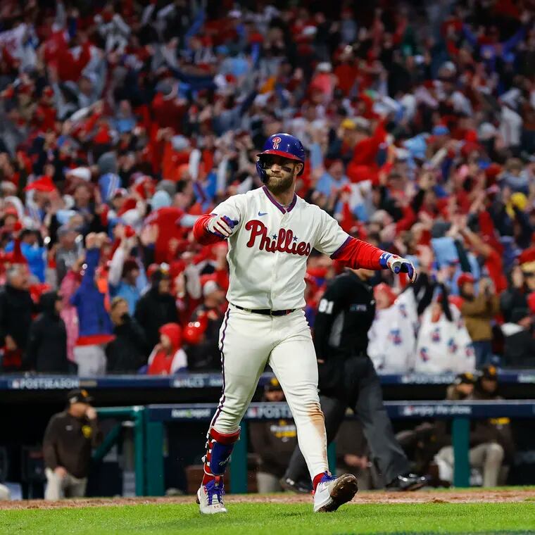 Bryce Harper reacts after hitting a two-run home run in the eighth inning to take the lead on the Padres in Game 5 of the NLCS in 2022.