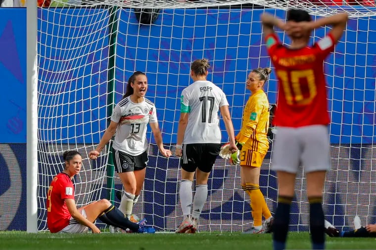 Germany's Sara Daebritz, top left, celebrates after scoring against Spain.