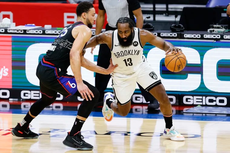 The Brooklyn Nets' James Harden drives against the 76ers' Ben Simmons in this Feb. 6 picture. The teams will meet for the third and final time Wednesday, and the Nets will be without Harden and Kyrie Irving.