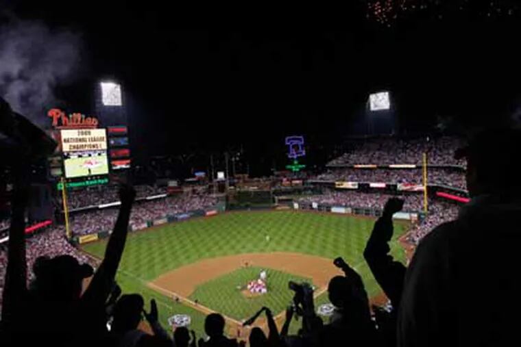 Fans go crazy as the Phils win Game 5 of the  NLCS series. ( Elizabeth Robertson / Staff Photographer )