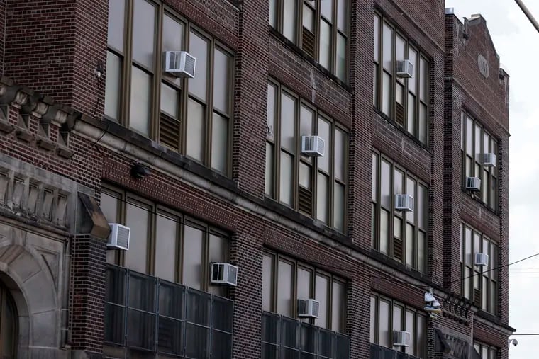 Bayard Taylor Elementary, in Philadelphia's Hunting Park section, has window air-conditioning units, but they don't adequately cool many rooms, a teacher said. The school was built in 1907; it's not among the 86 Philadelphia schools that closed early due to heat.