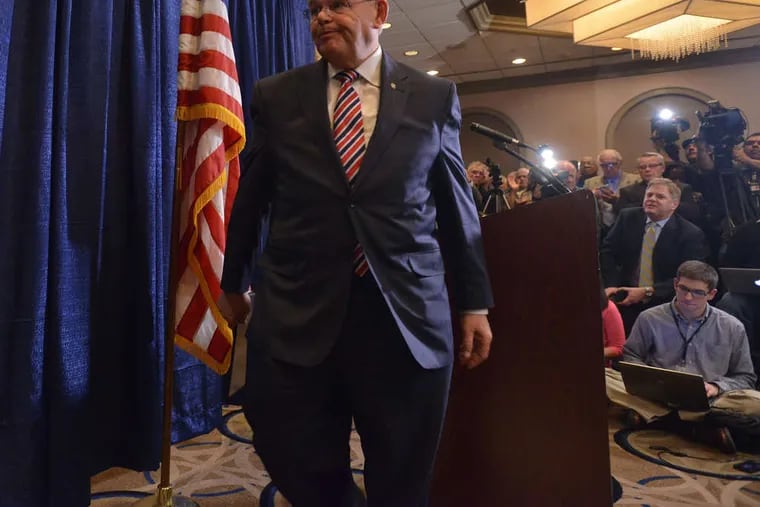 U.S. Sen. Robert Menendez leaves a news conference Wednesday after giving a statement following his indictment. He says he followed the law.