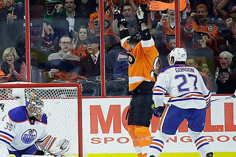 The Flyers' Jakub Voracek celebrates after scoring against the Oilers' Viktor Fasth as Boyd Gordon watches during the first period. (Matt Slocum/AP)