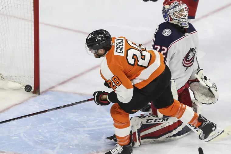 Claude Giroux, shown scoring against Columbus goalie Sergei Bobrovsky on Thursday, is fourth in the NHL with 72 points.