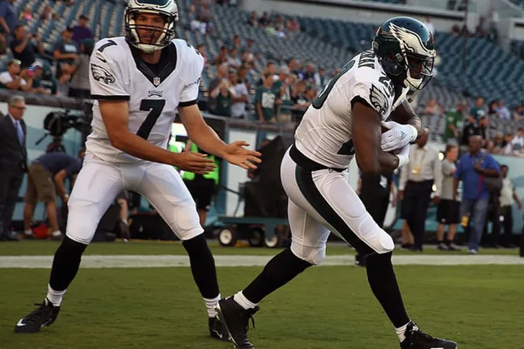 The Eagles' Sam Bradford, left, hands off the ball to DeMarco Murray as they warm up before the preseason game at Lincoln Financial Field on Aug. 22, 2015.