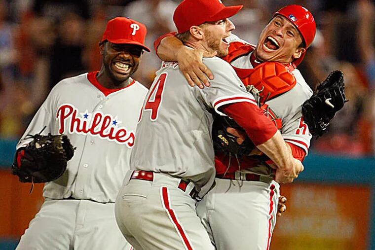 Phillies starting pitcher Roy Halladay celebrates with Carlos Ruiz in 2010. (Wilfredo Lee/AP)