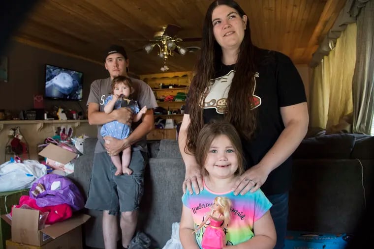 Brianna Kline is photographed with her daughters, Kylie Smith, 4, and Paisley Risser, 11 months, with fiance Christopher Risser at their home in Elizabethtown, Pa.