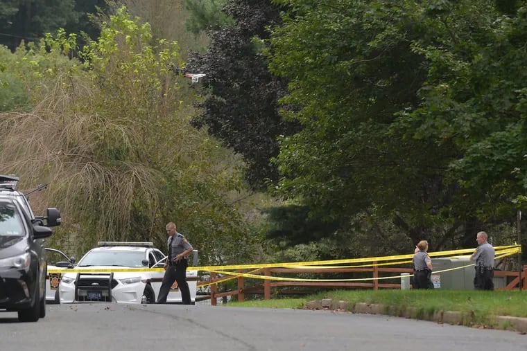 State Police investigate the scene of a shooting on Vermont Lane in Chester County.