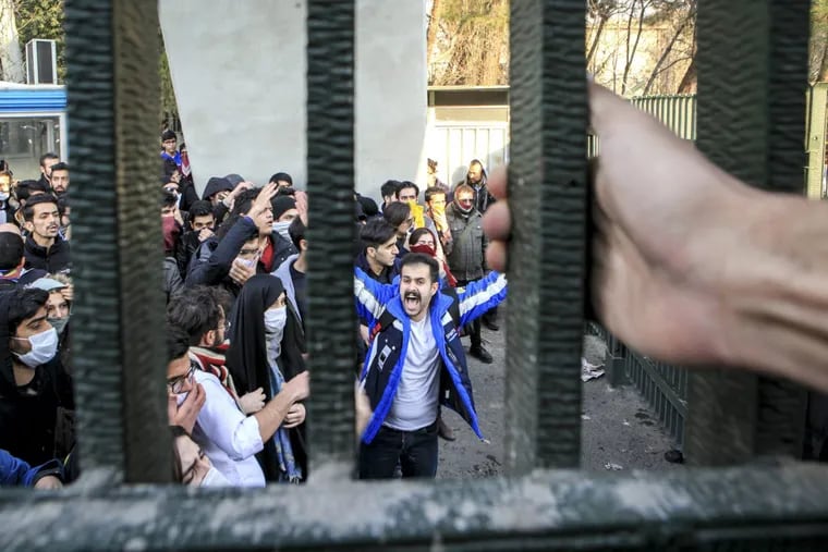 In this Saturday, Dec. 30, 2017 photo, by an individual not employed by the Associated Press and obtained by the AP outside Iran, university students attend an anti-government protest inside Tehran University, in Tehran, Iran. Demonstrations, the largest seen in Iran since its disputed 2009 presidential election, have brought days of unrest across the country and resulted in over 20 deaths.