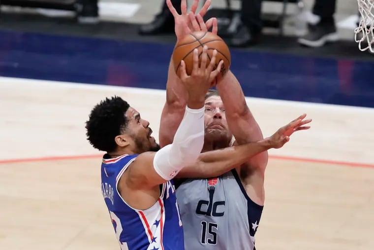 Sixers forward Tobias Harris drives to the basket against Washington Wizards center Robin Lopez in Game 4.