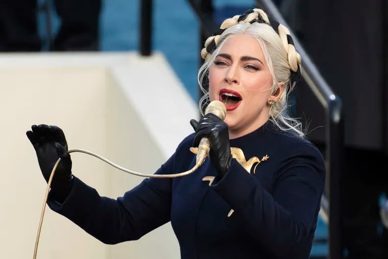 Lady Gaga sings the national anthem during President-elect Joe Biden's inauguration at the U.S. Capitol on Jan. 20, 2021. James Howard Jackson was sentenced to 21 years in prison for shooting and wounding her dog walker. He also stole her dogs. The Lady Gaga connection was a coincidence, authorities have said.