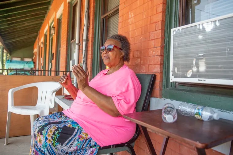 Erma Jones sits on the porch of her home in the 5400 block of Lansdowne Avenue, near Baker Playground in Overbrook, on Monday, July 15, 2019. Jones' grandson was celebrating his birthday at the playground Saturday night when shots rang out.
