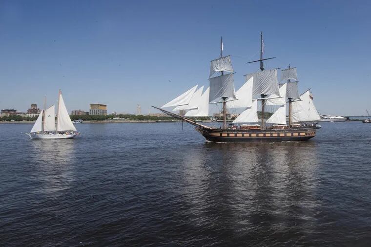 The Oliver Hazard Perry, right, sails through the waters of the Delaware river during the Parade of Sails at Penn’s Landing, Philadelphia on Thursday, May 24, 2018.