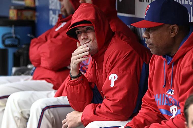 Phillies' pitcher Cole Hamels rubs his chin watching his team play the Marlins during the 9th inning at Citizens Bank Park in Philadelphia, Thursday, April 23, 2015. The Marlins beat the Phillies 9-1.  (Steven M. Falk/Staff Photographer)