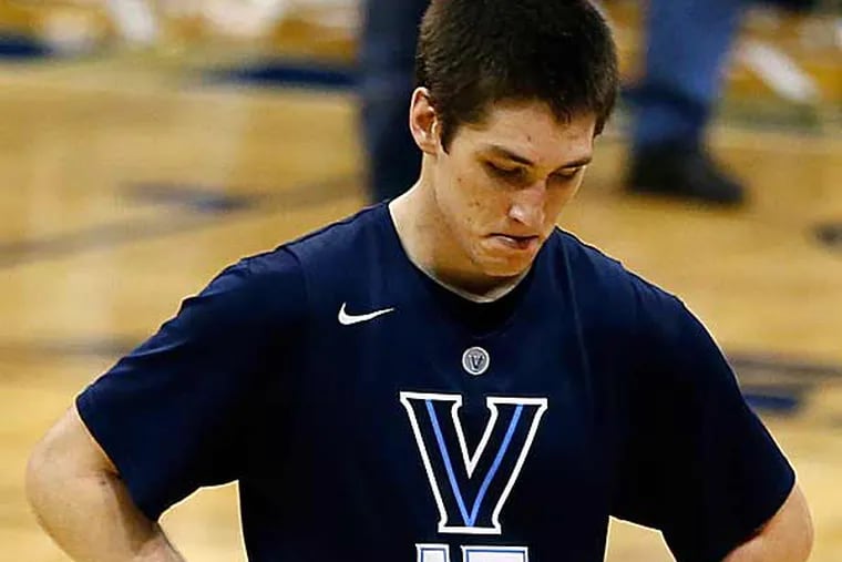 Villanova's Ryan Arcidiacono walks off the court as his team loses to Pittsburgh 73-64 in overtime. (Keith Srakocic/AP)