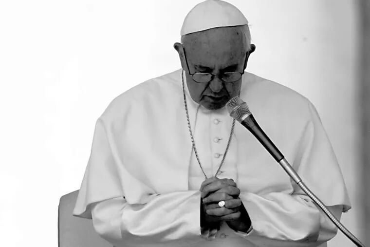 Pope Francis prays during his weekly general audience in St. Peter's Square last week.